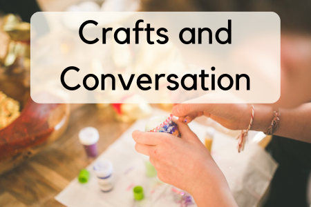 Overhead view of a person's hands. They are working on a beading project. 