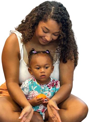 Mom and daughter participating in storytime