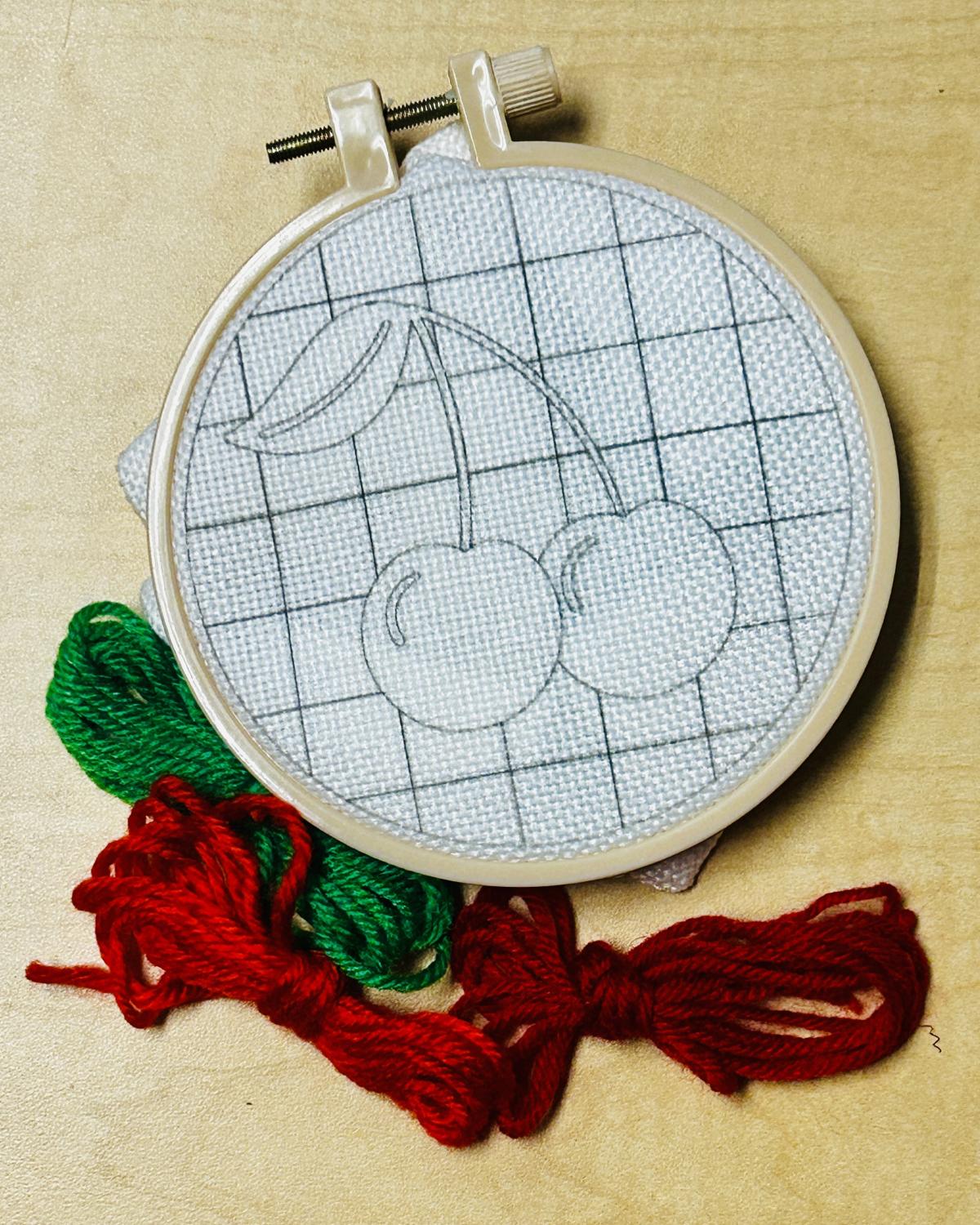 Materials to make embroidered cherries