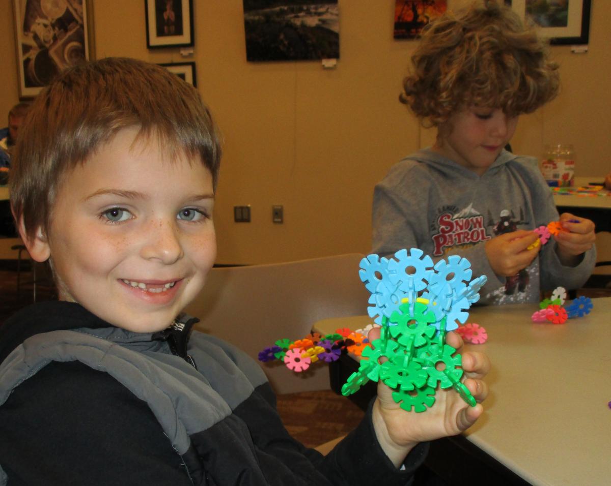 Tween using brainy flakes to build